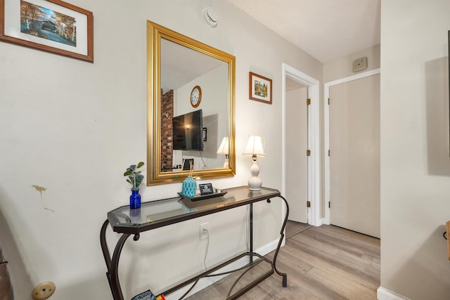 42 Wylie Ct Unit 6, Conway, NH 03860 - hall featuring light wood-type flooring and baseboards