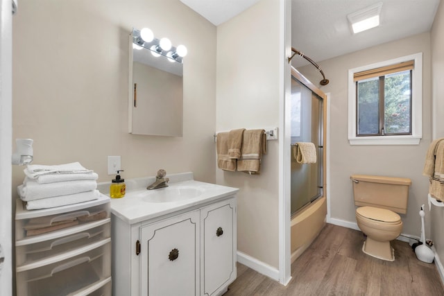 42 Wylie Ct Unit 6, Conway, NH 03860 - bathroom with wood finished floors, vanity, and combined bath / shower with glass door