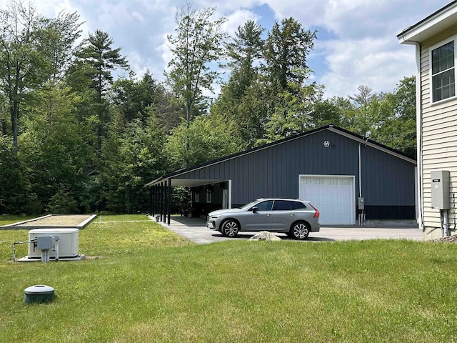 142 Eagle Shore Rd, Moultonborough, NH 03254 - view of grassy yard with an outdoor structure and a garage