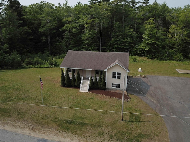 142 Eagle Shore Rd, Moultonborough, NH 03254 - view of front of property featuring a porch, driveway, and a wooded view