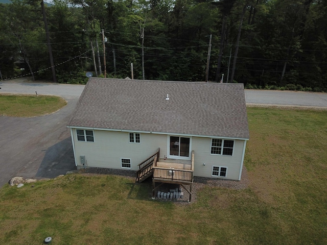 142 Eagle Shore Rd, Moultonborough, NH 03254 - rear view of property with a lawn, driveway, a deck, and a shingled roof
