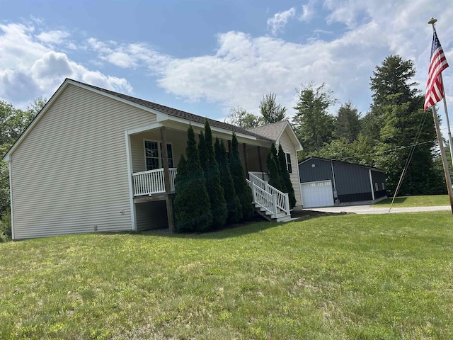 142 Eagle Shore Rd, Moultonborough, NH 03254 - view of property exterior with a garage, an outdoor structure, a yard, and concrete driveway