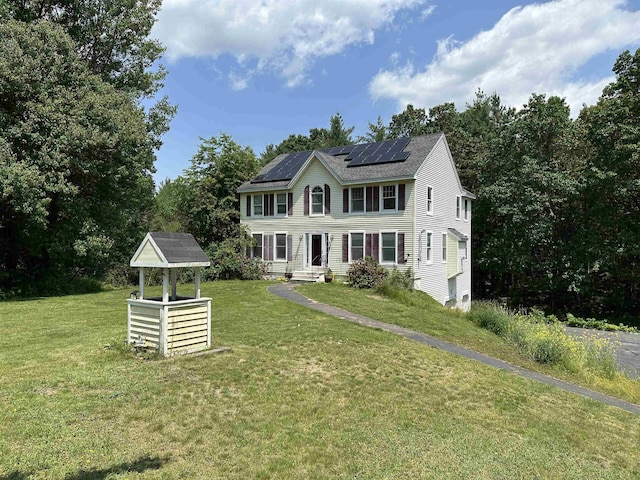2 Cobblestone Pl, Merrimack, NH 03054 - colonial house featuring solar panels, a front yard, and roof with shingles