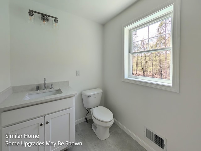 8 Meindl Rd Unit 1, Raymond, NH 03077 - bathroom featuring toilet and vanity