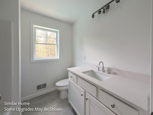 8 Meindl Rd Unit 1, Raymond, NH 03077 - bathroom with toilet and vanity