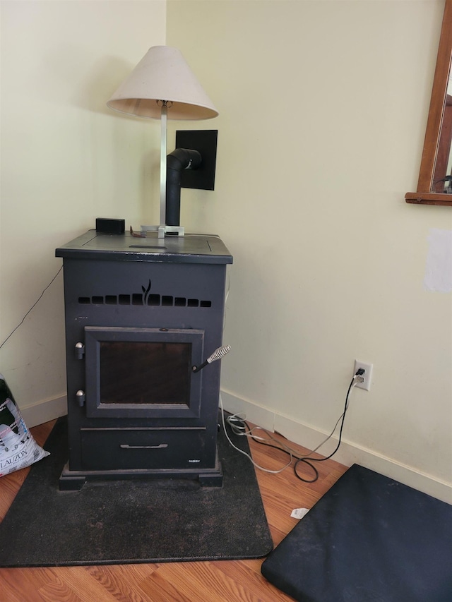 49 Tabor Cir, Albany, NH 03818 - detailed view of a wood stove and wood finished floors