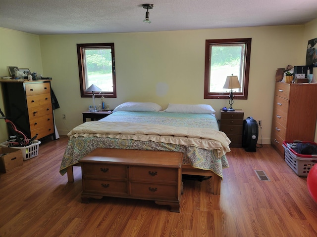 49 Tabor Cir, Albany, NH 03818 - bedroom with wood finished floors and a textured ceiling