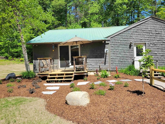 49 Tabor Cir, Albany, NH 03818 - view of front of property featuring a wooden deck and a metal roof