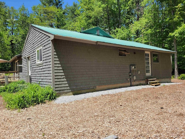49 Tabor Cir, Albany, NH 03818 - view of front of home with a metal roof and view of scattered trees