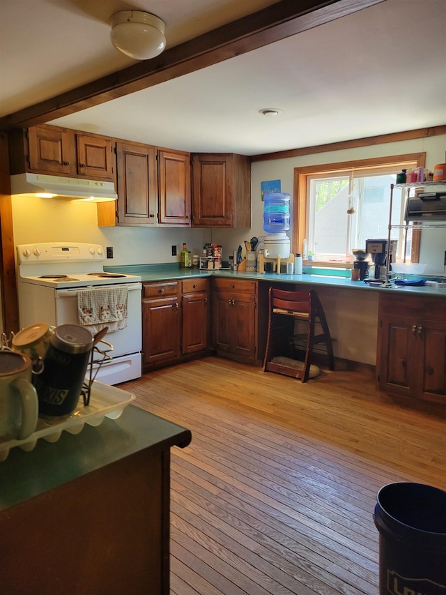 49 Tabor Cir, Albany, NH 03818 - kitchen featuring white electric stove, under cabinet range hood, light wood-style floors, beam ceiling, and a desk