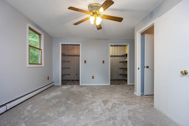 8 Jakes Ln, Merrimack, NH 03054 - unfurnished bedroom with a baseboard heating unit, carpet, and ceiling fan