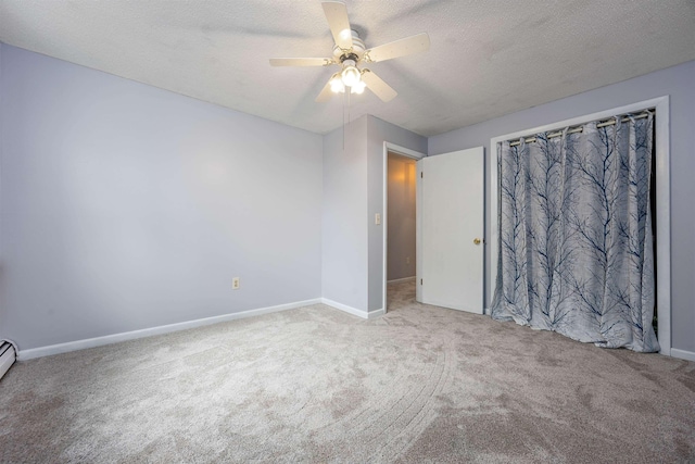 8 Jakes Ln, Merrimack, NH 03054 - unfurnished bedroom featuring carpet floors, a textured ceiling, and a ceiling fan
