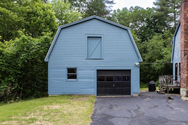 8 Jakes Ln, Merrimack, NH 03054 - view of home's exterior with a gambrel roof, a garage, an outbuilding, and a lawn
