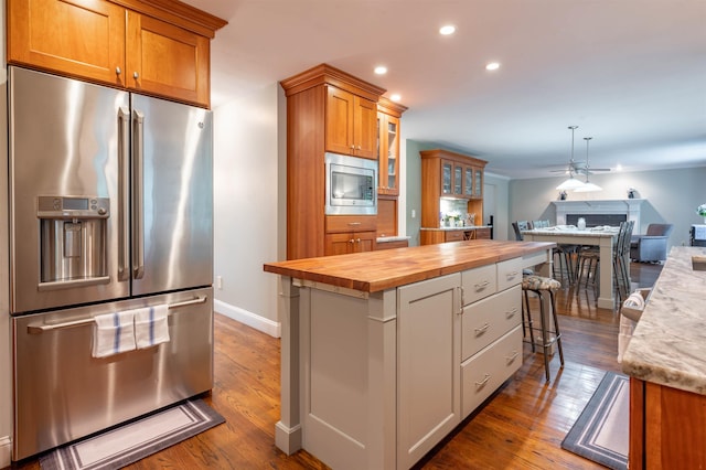 35 Fletcher Ln, Hollis, NH 03049 - kitchen with stainless steel appliances, wooden counters, ceiling fan, dark wood-style flooring, and recessed lighting