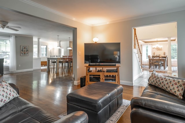 35 Fletcher Ln, Hollis, NH 03049 - living room with healthy amount of natural light, a chandelier, crown molding, a ceiling fan, and wood finished floors