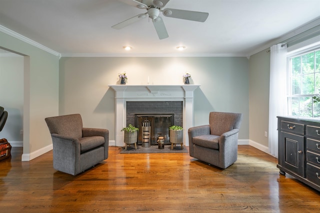 35 Fletcher Ln, Hollis, NH 03049 - sitting room with wood finished floors, ornamental molding, a ceiling fan, and a fireplace