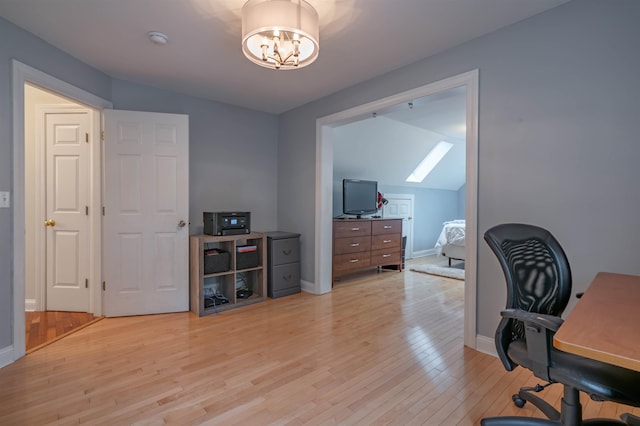 35 Fletcher Ln, Hollis, NH 03049 - office area with light wood-style flooring, a skylight, a chandelier, and lofted ceiling