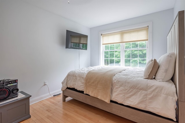 35 Fletcher Ln, Hollis, NH 03049 - bedroom with light wood finished floors and baseboards