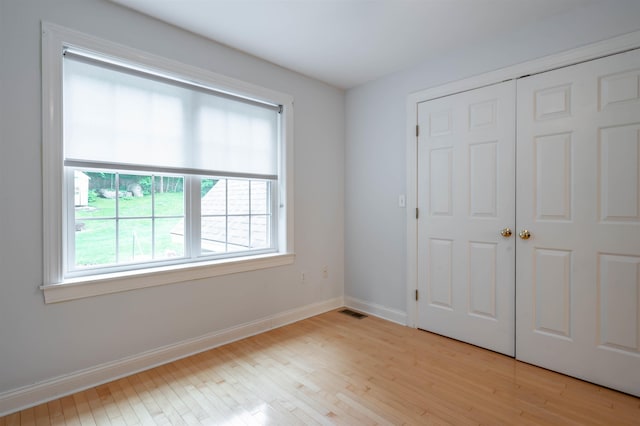 35 Fletcher Ln, Hollis, NH 03049 - unfurnished bedroom with light wood-style floors and a closet