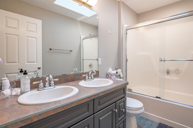35 Fletcher Ln, Hollis, NH 03049 - bathroom with double vanity, combined bath / shower with glass door, a skylight, and tile patterned floors