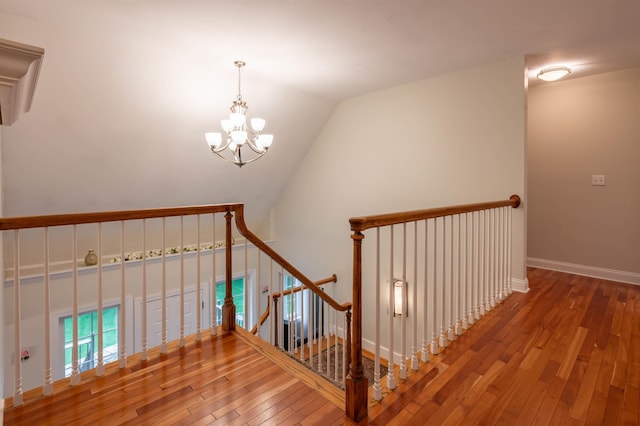 35 Fletcher Ln, Hollis, NH 03049 - stairs with wood-type flooring, a chandelier, and lofted ceiling
