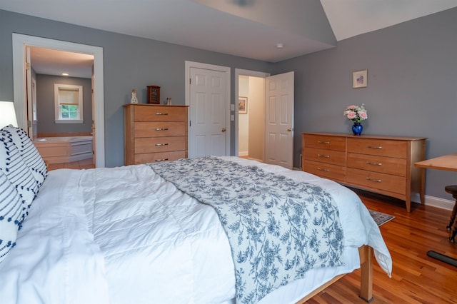 35 Fletcher Ln, Hollis, NH 03049 - bedroom featuring wood finished floors and lofted ceiling