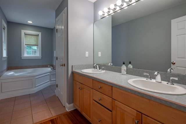 35 Fletcher Ln, Hollis, NH 03049 - full bathroom with double vanity, a bath, and tile patterned flooring