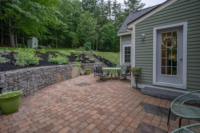 35 Fletcher Ln, Hollis, NH 03049 - view of patio / terrace featuring outdoor dining space and a shed