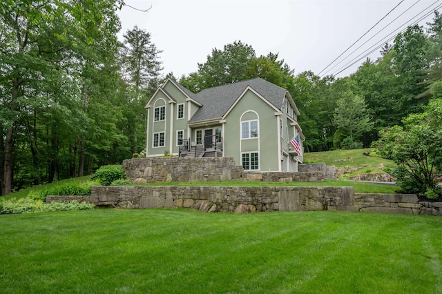 35 Fletcher Ln, Hollis, NH 03049 - view of front facade with stucco siding, a shingled roof, and a front yard