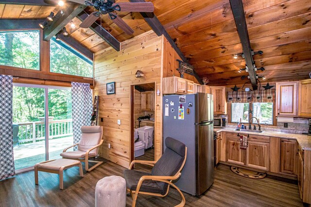 25 Singer Ln, Conway, NH 03813 - kitchen with stainless steel appliances, dark wood-style floors, wooden ceiling, a ceiling fan, and wood walls