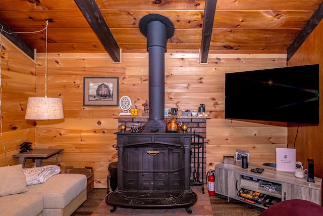 25 Singer Ln, Conway, NH 03813 - living room featuring a wood stove, wooden walls, and a wood ceiling with exposed beams