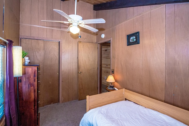 25 Singer Ln, Conway, NH 03813 - carpeted bedroom featuring wood walls, a closet, ceiling fan, and beam ceiling