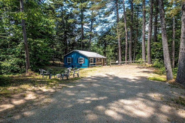 25 Singer Ln, Conway, NH 03813 - view of home's exterior featuring a view of trees