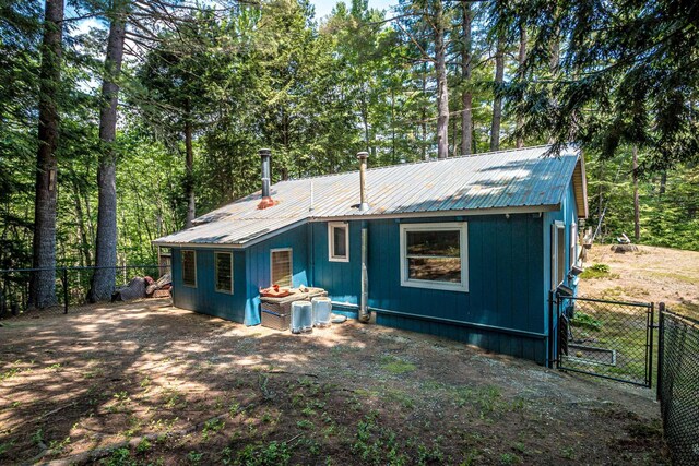 25 Singer Ln, Conway, NH 03813 - back of house featuring a gate and a metal roof