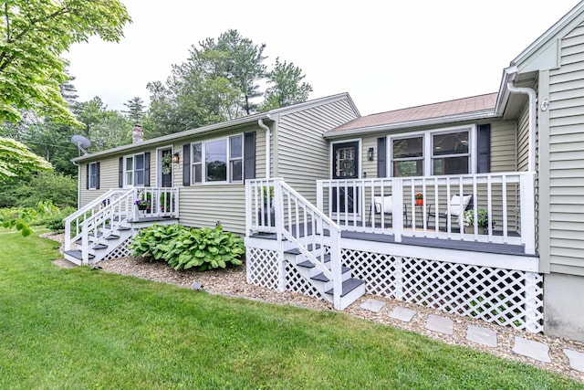 71/2 Olesen Rd, Derry, NH 03038 - view of front of property featuring a front lawn, a deck, and a chimney