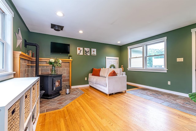 71/2 Olesen Rd, Derry, NH 03038 - living area featuring a wood stove, recessed lighting, and wood finished floors