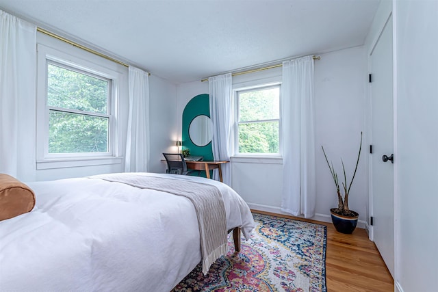 71/2 Olesen Rd, Derry, NH 03038 - bedroom with light wood-style flooring and baseboards