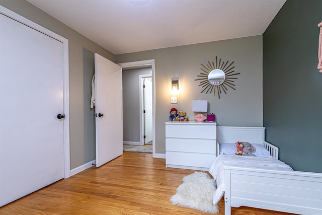 71/2 Olesen Rd, Derry, NH 03038 - bedroom featuring light wood-type flooring and baseboards
