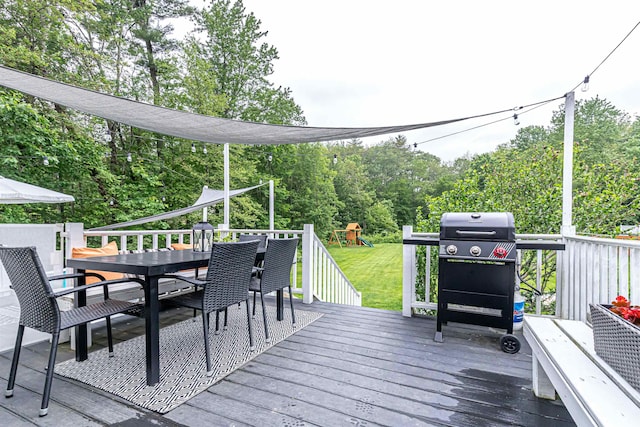 71/2 Olesen Rd, Derry, NH 03038 - wooden terrace with outdoor dining space, a playground, a lawn, and view of scattered trees