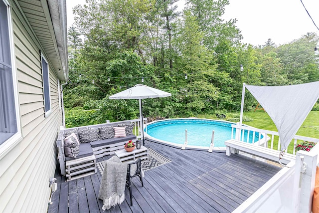 71/2 Olesen Rd, Derry, NH 03038 - outdoor pool with a wooden deck, outdoor lounge area, and view of scattered trees