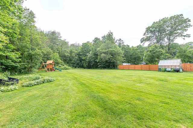 71/2 Olesen Rd, Derry, NH 03038 - view of yard featuring an exterior structure, a playground, and an outdoor structure