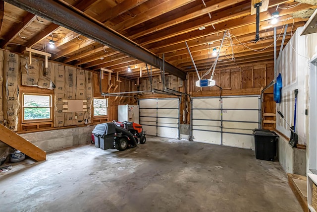 71/2 Olesen Rd, Derry, NH 03038 - garage with a garage door opener and fridge with ice dispenser
