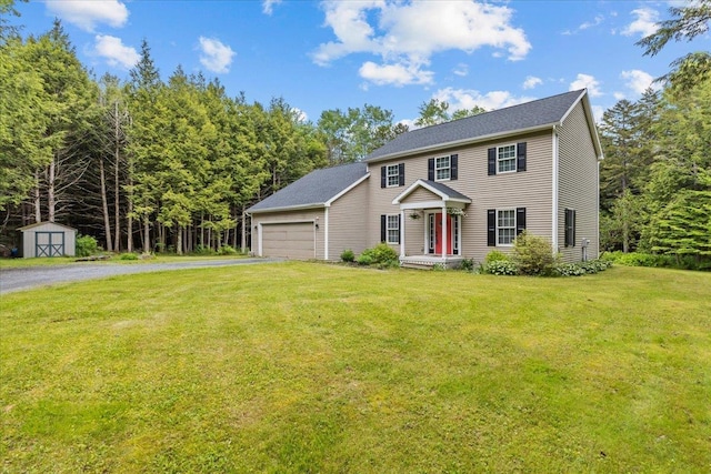 14 Audry Ln, Westford, VT 05494 - colonial inspired home featuring a garage, asphalt driveway, a shed, and a front yard