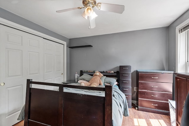 245 W River Rd, Hooksett, NH 03106 - bedroom with light wood-type flooring, ceiling fan, and a closet