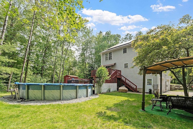 245 W River Rd, Hooksett, NH 03106 - view of green lawn with a covered pool, a shed, stairway, and a wooden deck