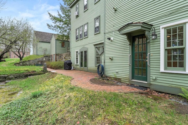 85 Dartmouth College Hwy Unit 204, Lyme, NH 03768 - rear view of house with a patio and a yard