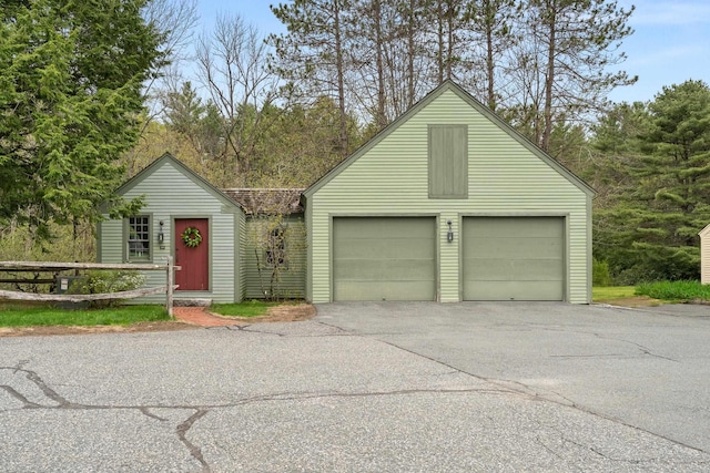 85 Dartmouth College Hwy Unit 204, Lyme, NH 03768 - view of front facade with a garage