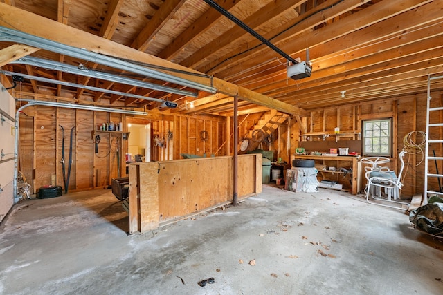 85 Dartmouth College Hwy Unit 204, Lyme, NH 03768 - garage with a workshop area and a garage door opener