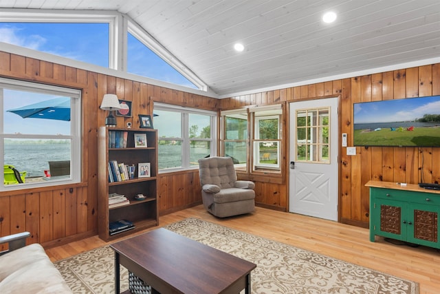 174 Kirk And Fitts Rd, Alburgh, VT 05440 - living room with vaulted ceiling, wooden walls, wood finished floors, a water view, and recessed lighting