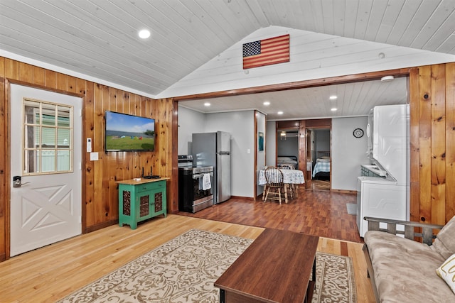 174 Kirk And Fitts Rd, Alburgh, VT 05440 - living room featuring vaulted ceiling, wooden walls, light wood-style floors, recessed lighting, and wooden ceiling